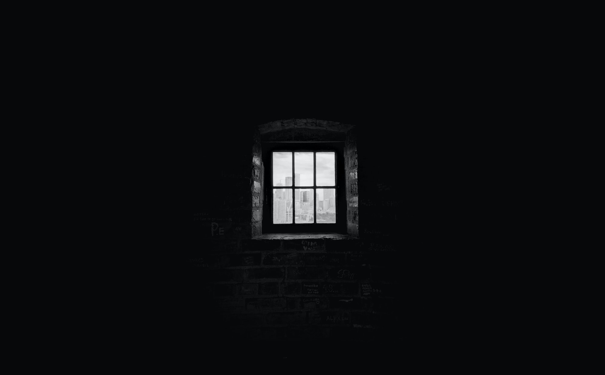 Image of dark room with a small window in the distance that is letting in a little light. Image links to webpage describing narcissistic abuse and its treatment