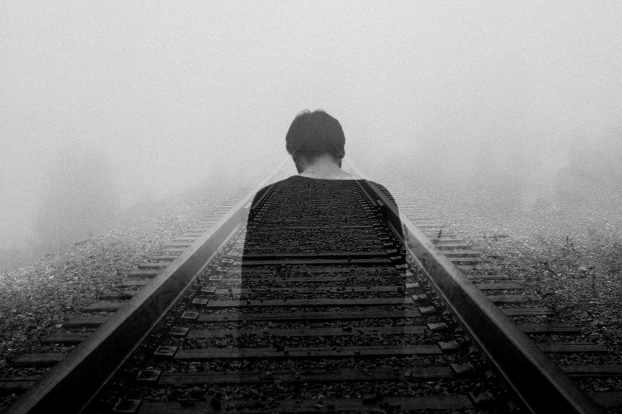 Black and white image of man looking depressed, sad, and lonely. Image links to webpage describing depression and its treatment.